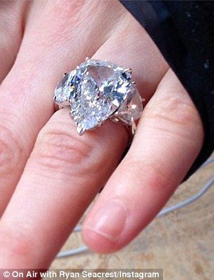 avril lavigne's pear-shaped engagement ring with half-moon side stones