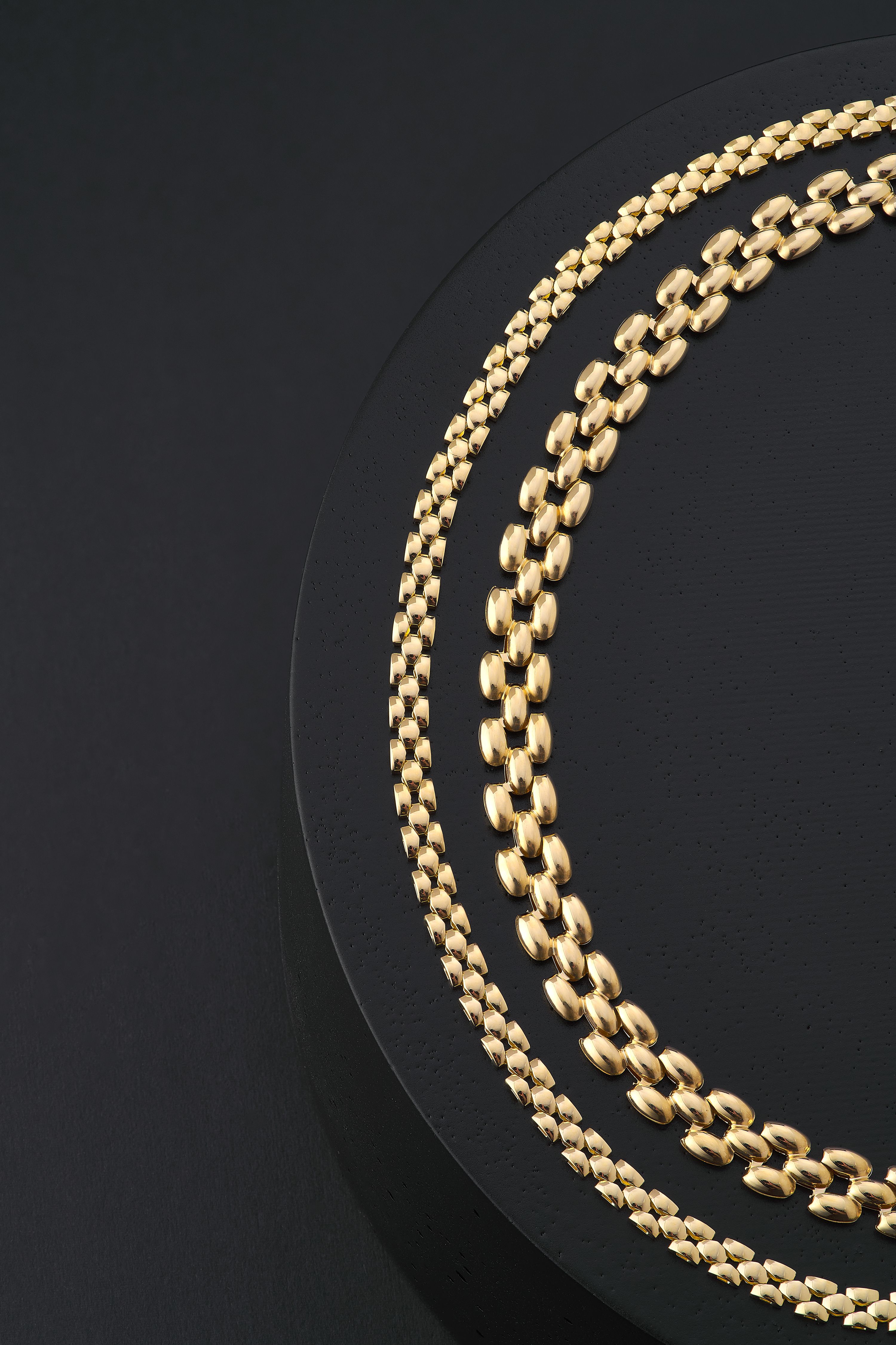 Image of two thick gold necklaces