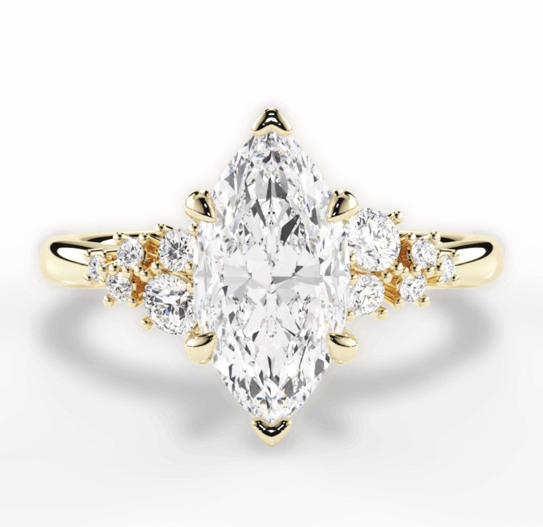 Image of marquise diamond ring set in yellow gold