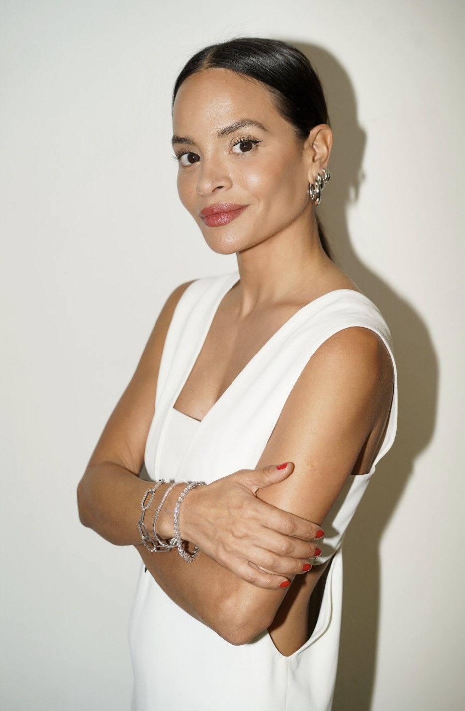 Image of woman wearing white with silver jewelry 