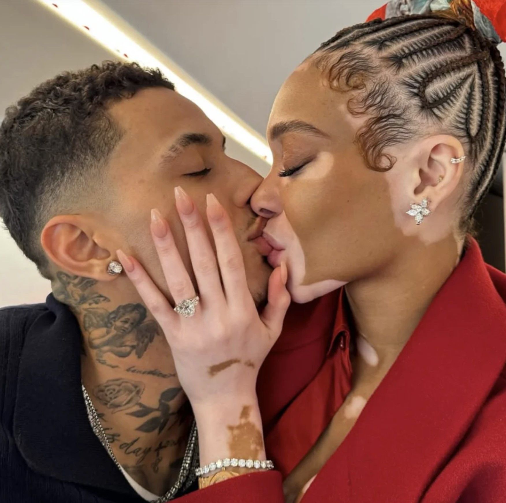 Image of Winnie Harlow and Kyle Kuzma kissing showing her diamond engagement ring