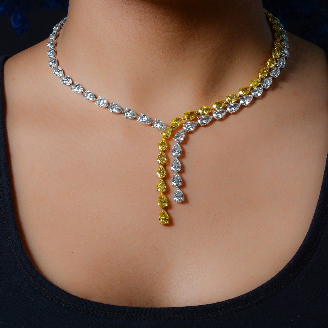 Image of model wearing a yellow and white diamond necklace