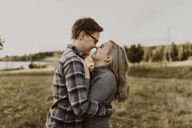 happy couple in a field