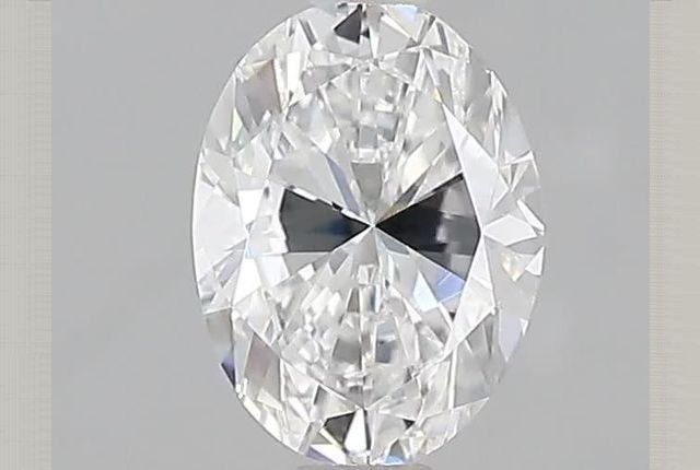 oval cut diamond with small bow tie