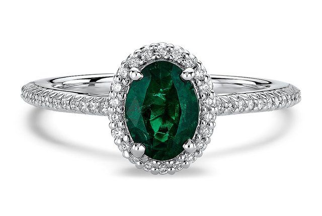 emerald cocktail ring with diamond halo