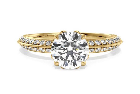 knife edge engagement ring with diamond side stones