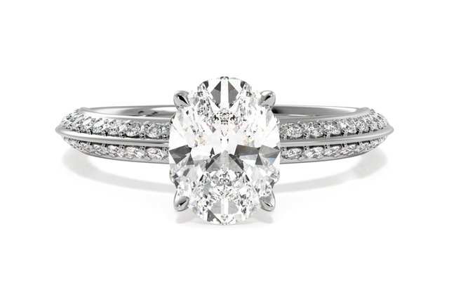 oval cut diamond in a sidestone setting