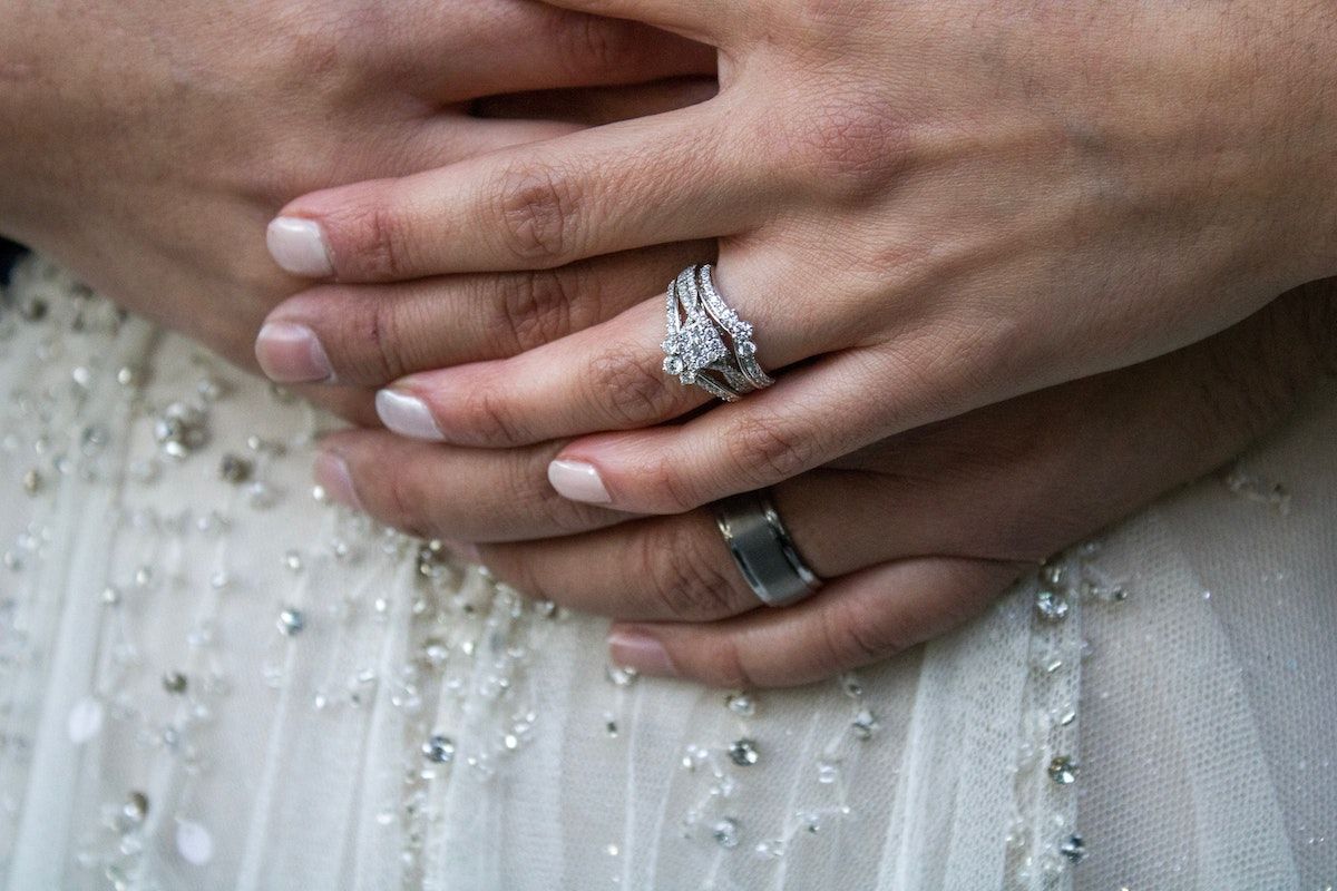 woman wearing ring guard around her engagement ring